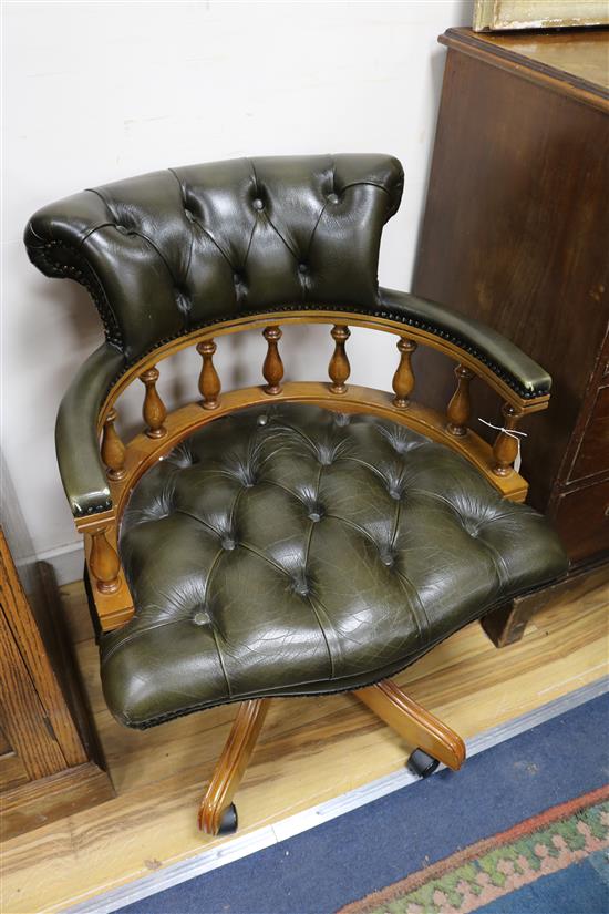 A pair of leather swivel desk chairs
